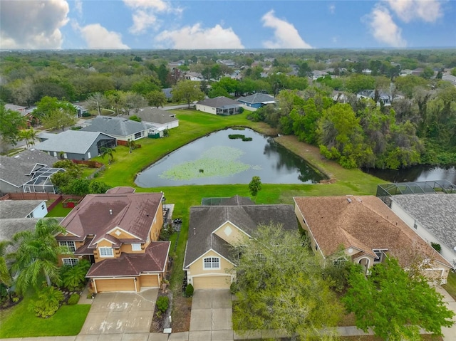 drone / aerial view featuring a water view and a residential view