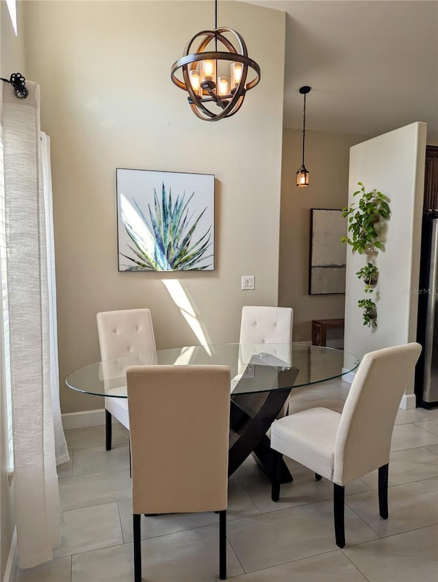 dining area with an inviting chandelier