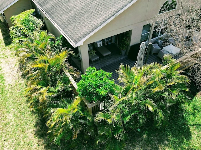 exterior space featuring a shingled roof