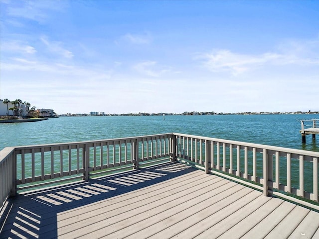 wooden deck with a water view