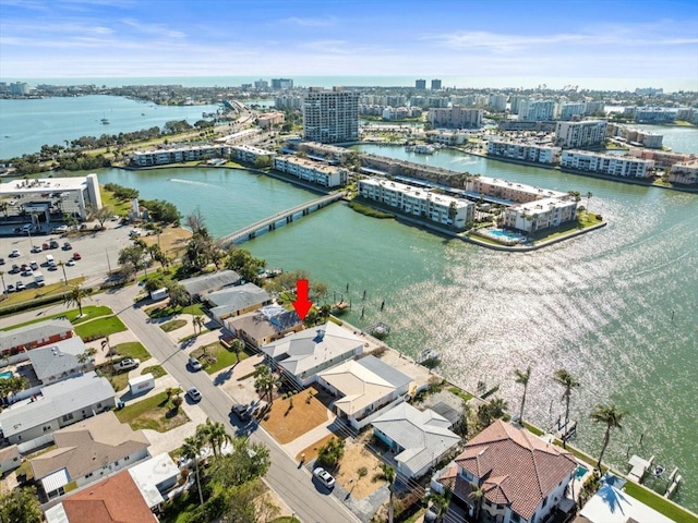 bird's eye view featuring a water view and a view of city