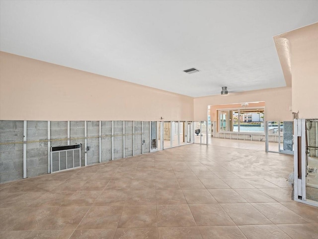 empty room featuring tile patterned floors and visible vents