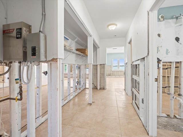 hall with light tile patterned floors