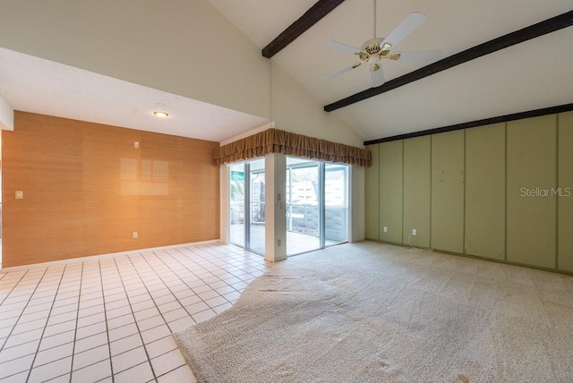 tiled empty room featuring beam ceiling, high vaulted ceiling, a ceiling fan, and carpet