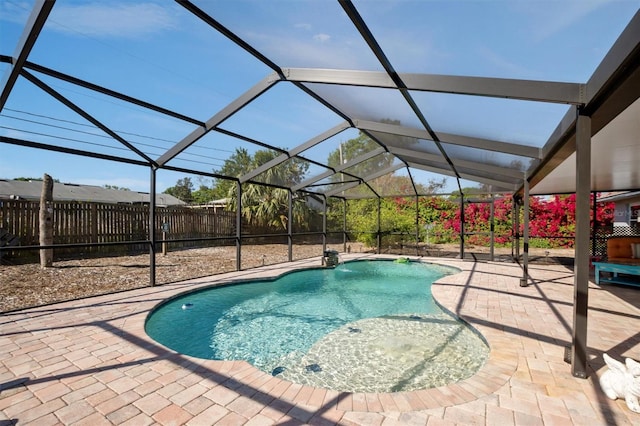 view of pool featuring a fenced in pool, fence, a lanai, and a patio area