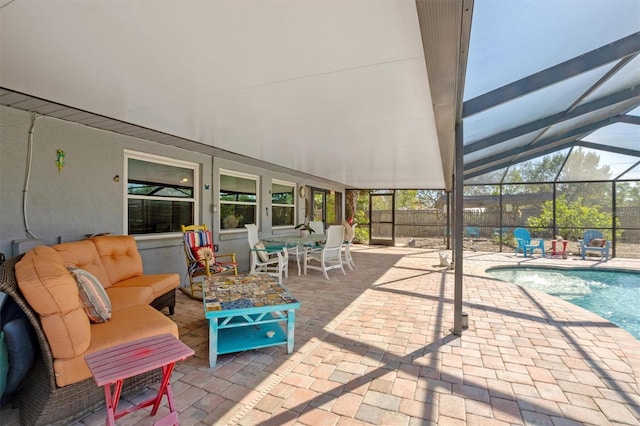 view of patio / terrace featuring a lanai, an outdoor pool, and an outdoor hangout area