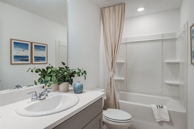 bathroom with shower / bathtub combination with curtain, toilet, and vanity