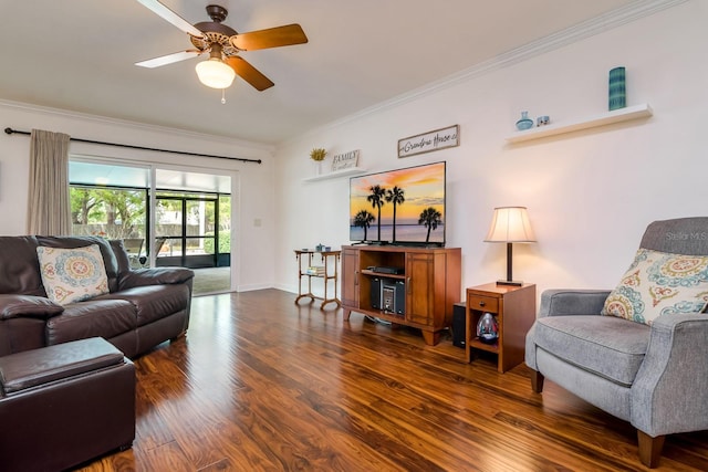 living area featuring baseboards, a ceiling fan, wood finished floors, and crown molding