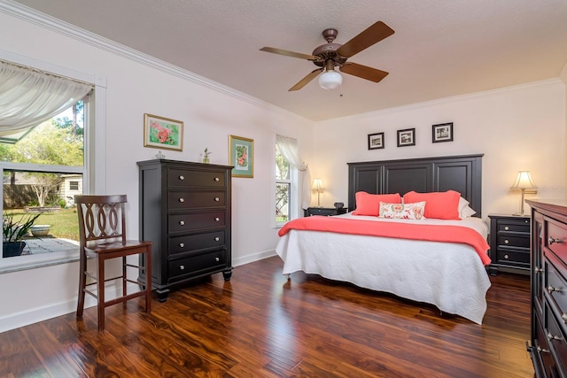 bedroom featuring multiple windows, crown molding, baseboards, and wood finished floors