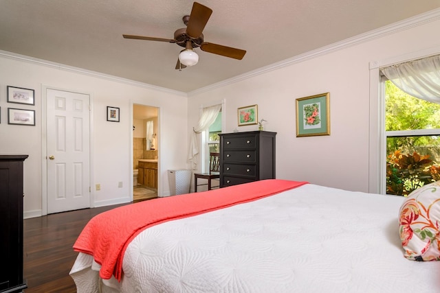 bedroom with wood finished floors, baseboards, ceiling fan, ensuite bathroom, and crown molding