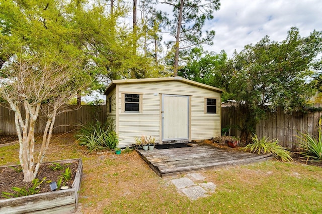 view of shed with a garden and a fenced backyard