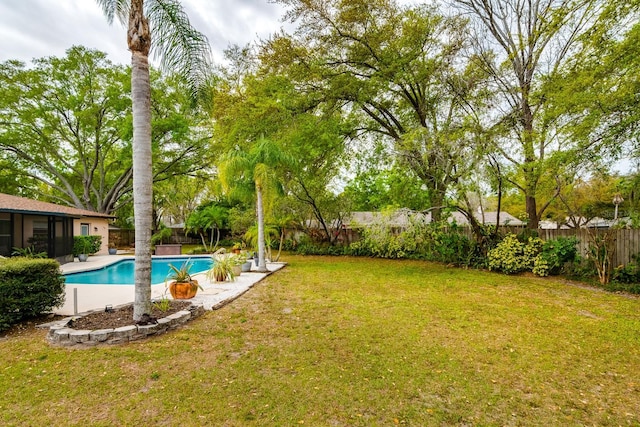 view of yard featuring a fenced in pool and a fenced backyard