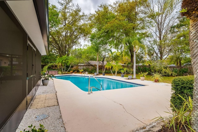 view of swimming pool featuring a patio, a fenced backyard, and a fenced in pool