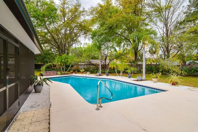 view of pool featuring a fenced in pool, a fenced backyard, and a patio area