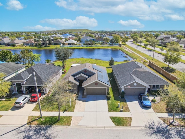 bird's eye view featuring a residential view and a water view