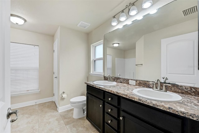 full bath with tile patterned flooring, baseboards, visible vents, and a sink