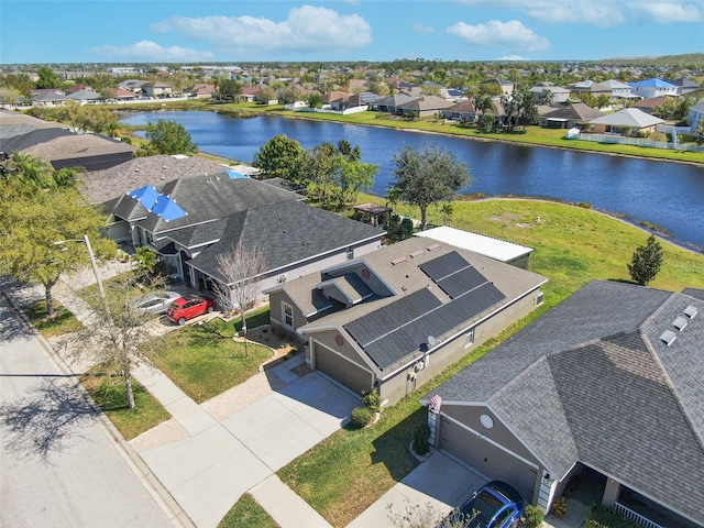 bird's eye view featuring a residential view and a water view