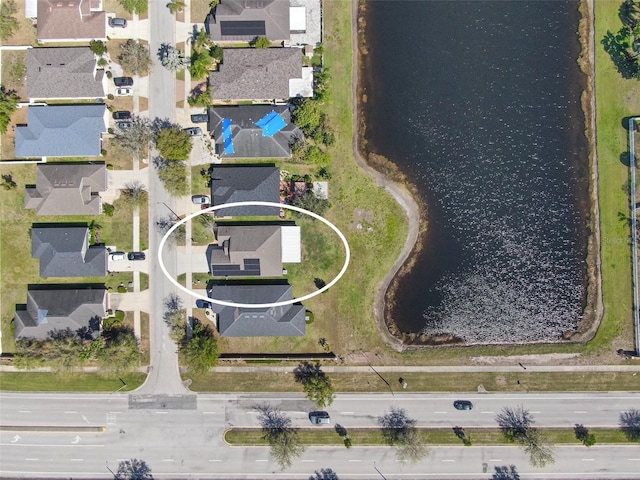 aerial view with a residential view and a water view