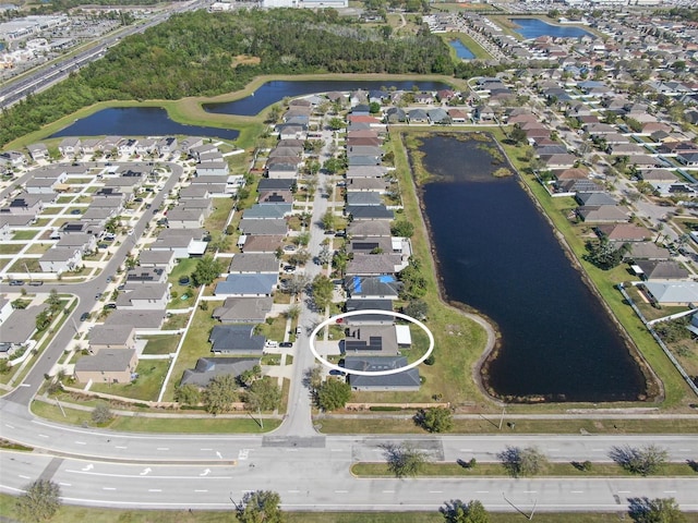 aerial view with a water view and a residential view