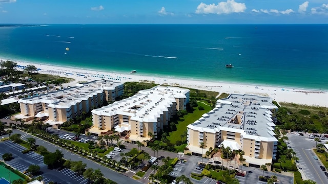 bird's eye view featuring a view of the beach and a water view