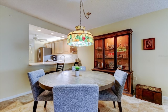 dining room with a ceiling fan, recessed lighting, and baseboards