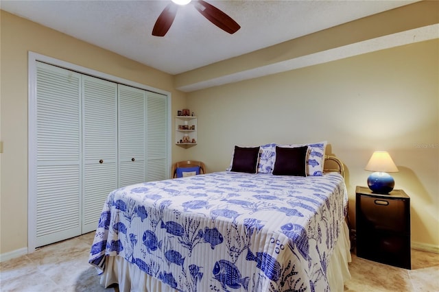 bedroom featuring baseboards, a closet, and ceiling fan