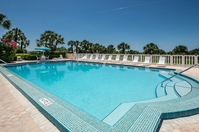 community pool featuring a patio area