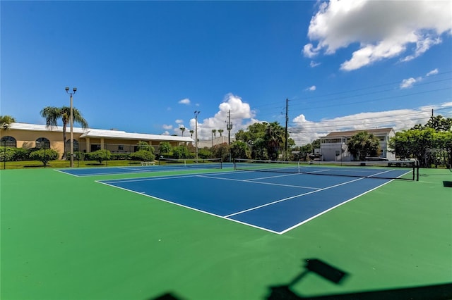 view of sport court featuring fence