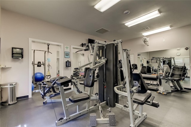 gym with baseboards and visible vents