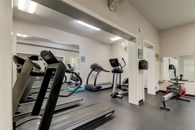 workout area featuring baseboards