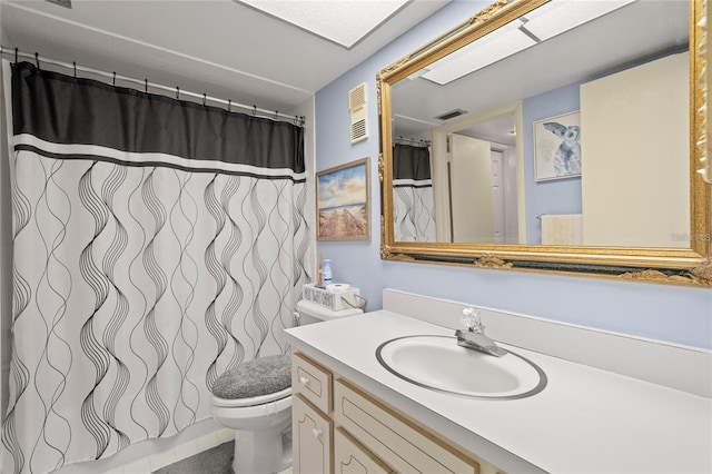 full bathroom featuring visible vents, toilet, vanity, and tile patterned flooring