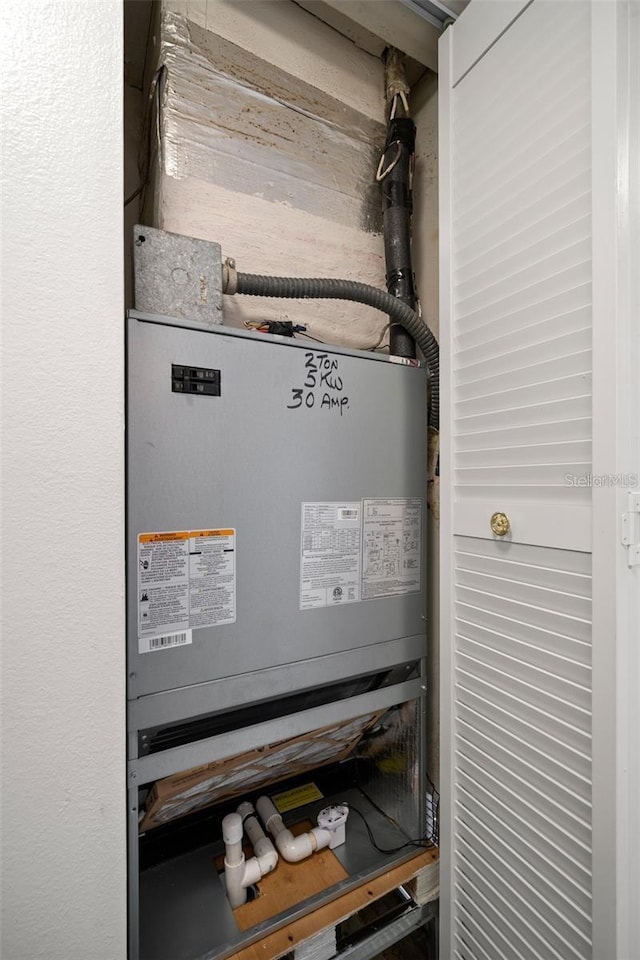 utility room with heating unit