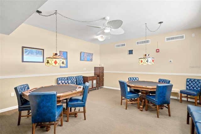 dining space with visible vents, ceiling fan, and carpet floors