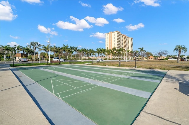 view of property's community featuring shuffleboard