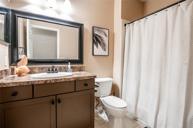 bathroom featuring tile patterned floors, toilet, vanity, and a shower with curtain