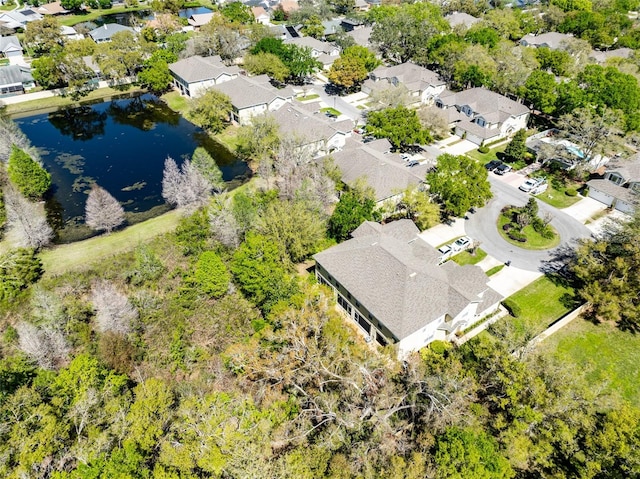 bird's eye view featuring a residential view and a water view