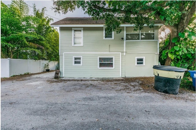 rear view of house with fence