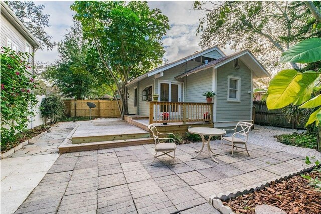 view of patio with a fenced backyard and a wooden deck