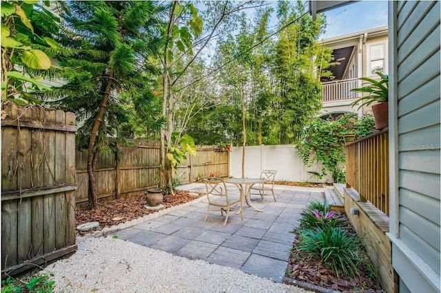 view of patio featuring a fenced backyard and outdoor dining space