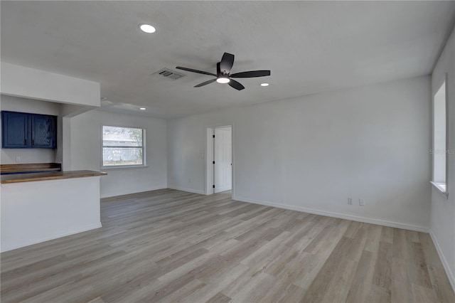 unfurnished living room with recessed lighting, baseboards, visible vents, and light wood finished floors