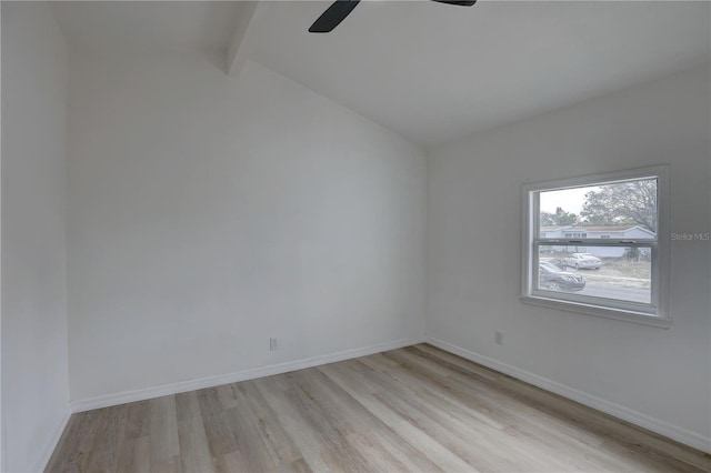 empty room featuring lofted ceiling with beams, baseboards, light wood-style floors, and a ceiling fan