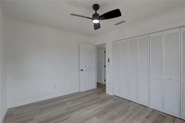 unfurnished bedroom with visible vents, baseboards, light wood-style floors, a closet, and a ceiling fan