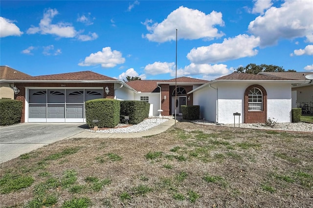 3943 W Fieldwood Ct, Lecanto, FL 34461 - ranch-style house featuring an attached garage, driveway, and stucco siding