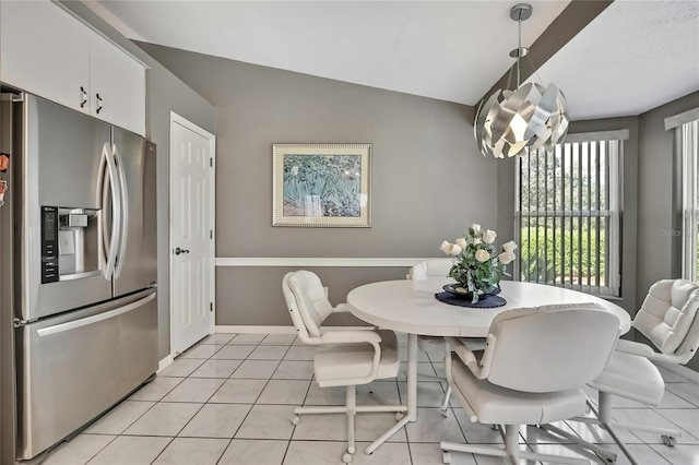 3943 W Fieldwood Ct, Lecanto, FL 34461 - dining area with lofted ceiling, baseboards, and a chandelier