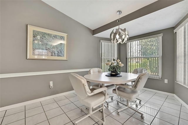 3943 W Fieldwood Ct, Lecanto, FL 34461 - dining space with a chandelier, light tile patterned floors, baseboards, and lofted ceiling