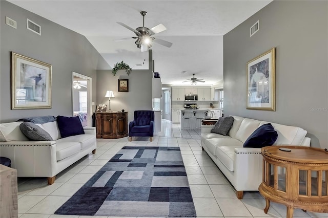 3943 W Fieldwood Ct, Lecanto, FL 34461 - living area with ceiling fan, light tile patterned flooring, and vaulted ceiling