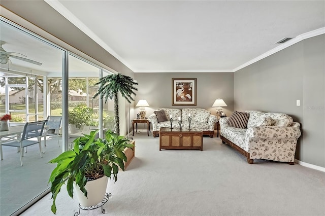 3943 W Fieldwood Ct, Lecanto, FL 34461 - living area featuring crown molding, carpet flooring, ceiling fan, and baseboards