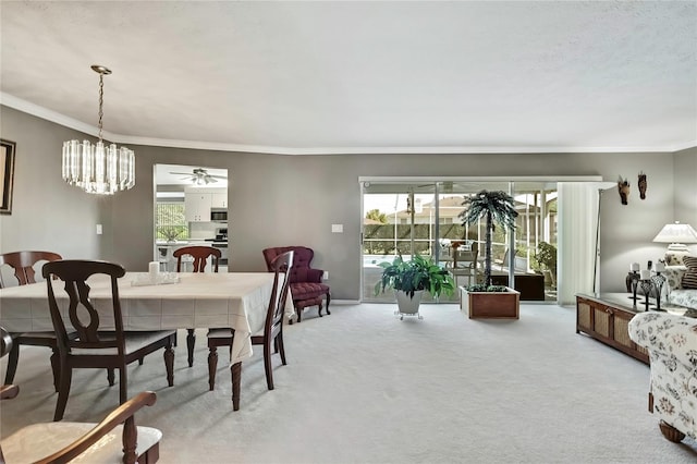 3943 W Fieldwood Ct, Lecanto, FL 34461 - dining space featuring light colored carpet, crown molding, plenty of natural light, and a ceiling fan