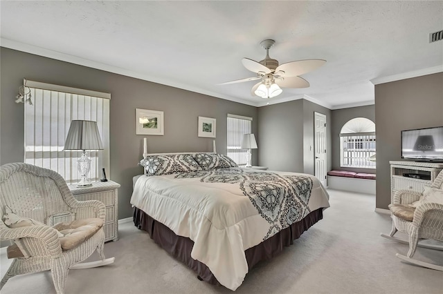 3943 W Fieldwood Ct, Lecanto, FL 34461 - bedroom featuring light carpet, multiple windows, ornamental molding, ceiling fan, and baseboards