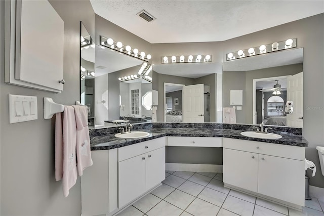 3943 W Fieldwood Ct, Lecanto, FL 34461 - full bathroom with ensuite bath, vanity, tile patterned floors, and ceiling fan